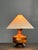 English table lamp from the 1950s–60s with a hand-turned wooden base featuring geometric inlay work. The design centers on...