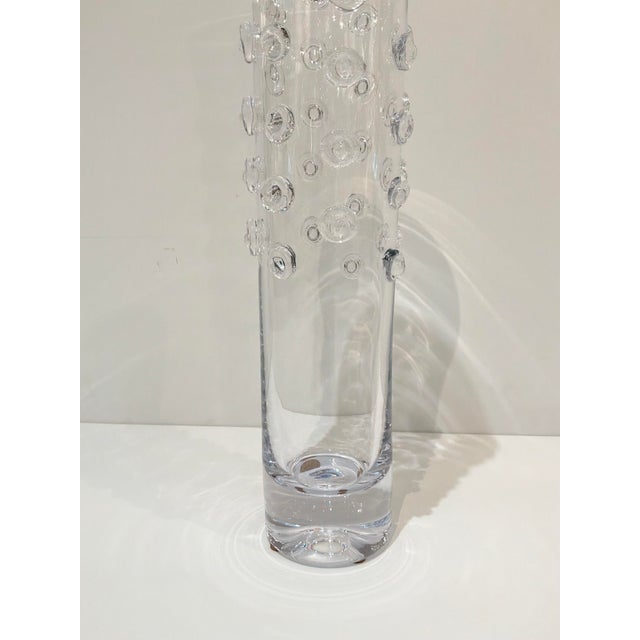 Elegant Chip Scarborough Tall handblown glass vase with applied glass buttons. Showroom floor sample.