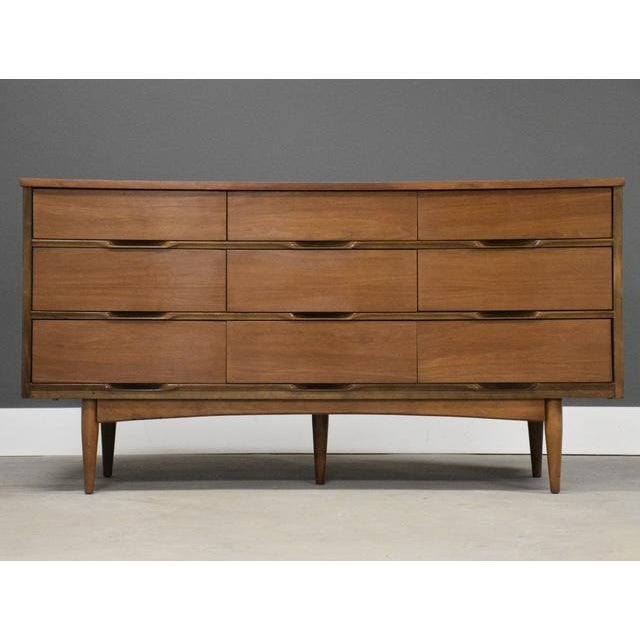 A mid century modern walnut dresser with a scratch resistant formica top. Circa 1960’s. Made in USA. Excellent original...