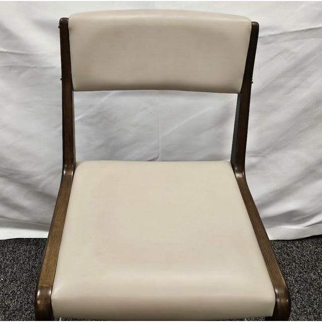 Interlude Home Tate Mid-Century Modern Dining Chair in Walnut & Cream Latte Elevate your dining experience with the...