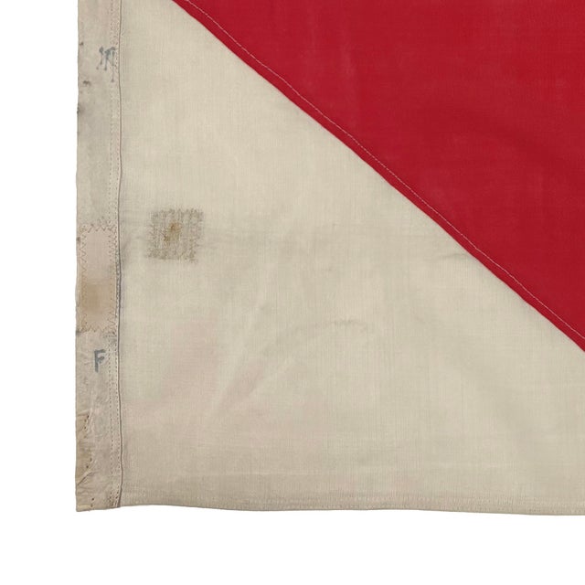 This vintage nautical signal flag is fully sewn from a thin cloth, possibly a blend of wool and synthetic fiber. Please...