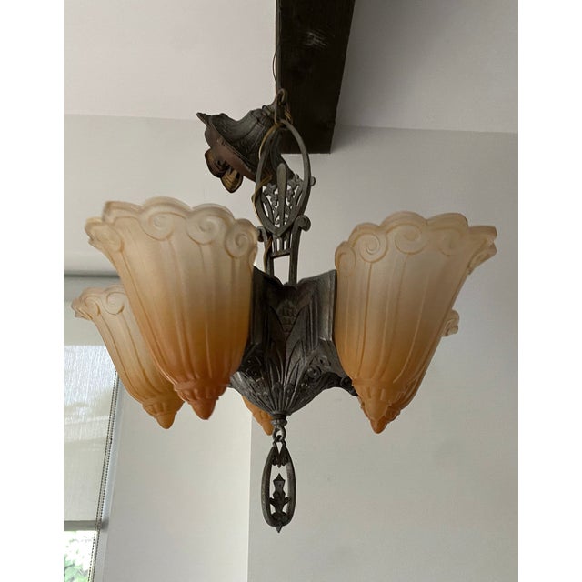 This is an original 1930's Fleur de Lis Art Deco 5 arm chandelier by Lincoln Manufacturing Co. This is in excellent...