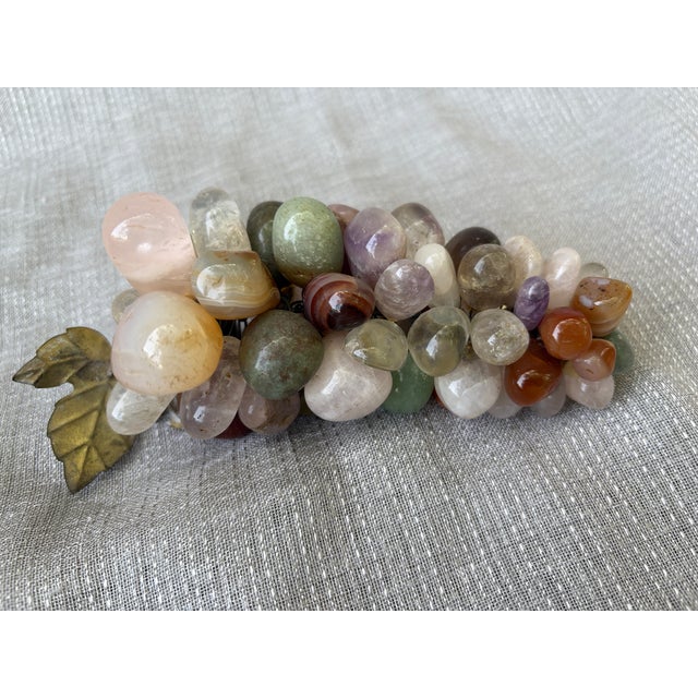 Vintage natural mixed polished gemstone grape cluster accented with a small single brass leaf. A rainbow of muted...