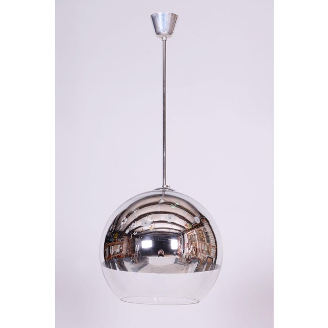 This original chandelier, created in Germany during the 1970s, carries the unmistakable signature of the progressive...