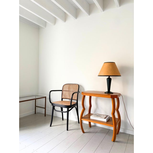 Early 20th century wooden side table with rare pinched leg detail. This Art Deco design lamp table or occasional table is...