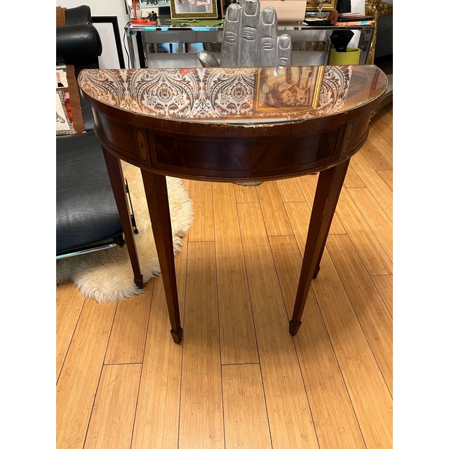 Up for consideration is a beautiful demilune wooden glass top table. This would look lovely on display in your home and it...