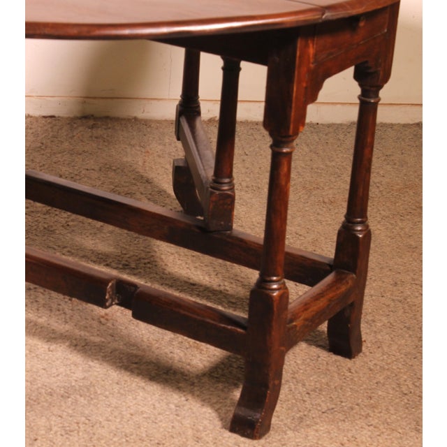 Charming 18th-century English oak drop-leaf table, known as a Gateleg. This lovely small table features a superb and...