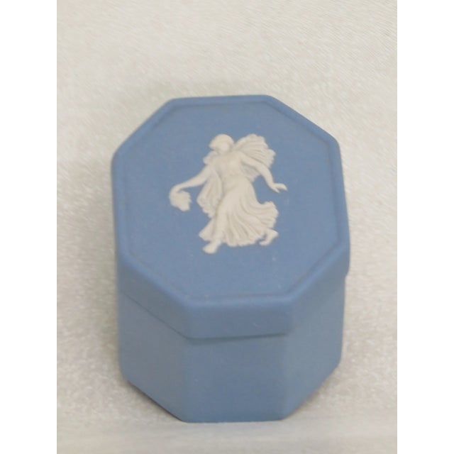 This lovely pill box / small jewelry box is made of porcelain. This charming piece is stamped as being made by Wedgwood in...