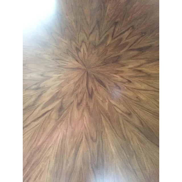 A handcrafted dining table. The original table is artfully composed of 29 individual disks; the impressive top is...