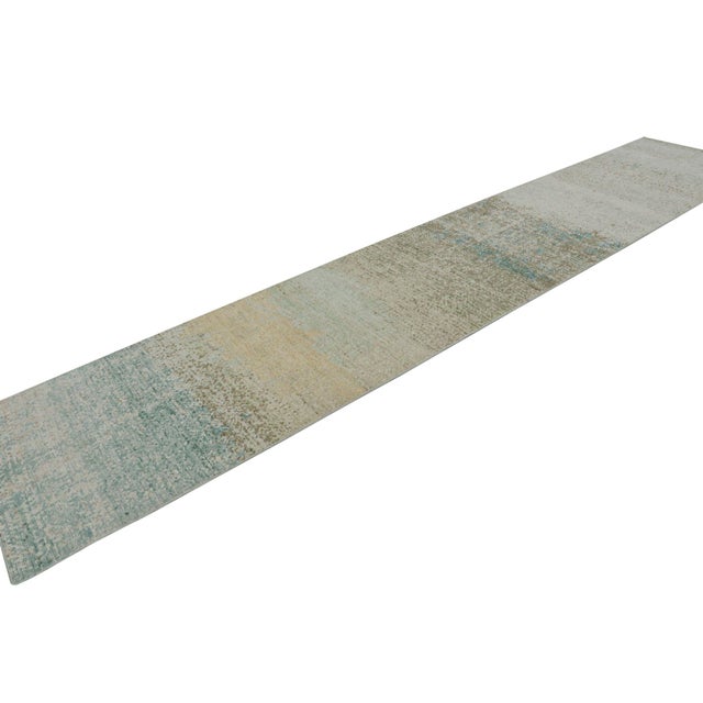 This 3x16 runner rug is from the Homage Collection by Rug & Kilim—made with hand-knotted wool in a modern take on...