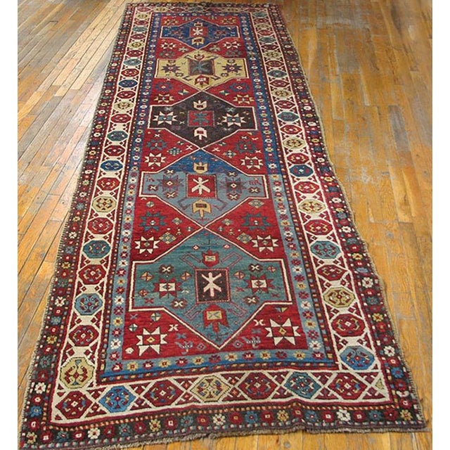 Antique Caucasian Red 1890s Hallway Runner, Circa Date: 1890s. This exceptional example of Caucasian weaving captures the...