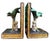 A charming pair of vintage hand-painted bookends featuring sculptural monkeys seated beneath lush palm trees. Rich faux...