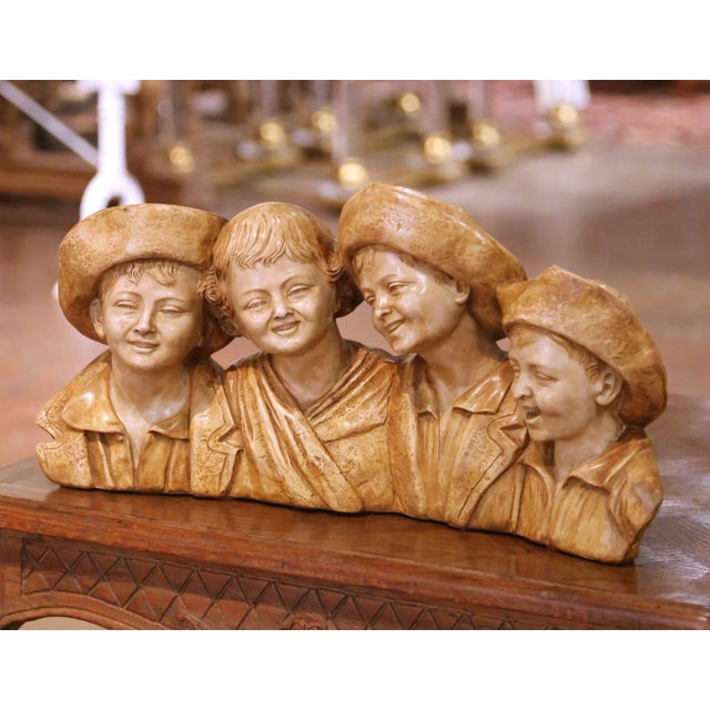 This charming antique terracotta sculpture from Italy, circa 1930, depicts four young boys grouped shoulder to shoulder in...