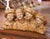 This charming antique terracotta sculpture from Italy, circa 1930, depicts four young boys grouped shoulder to shoulder in...