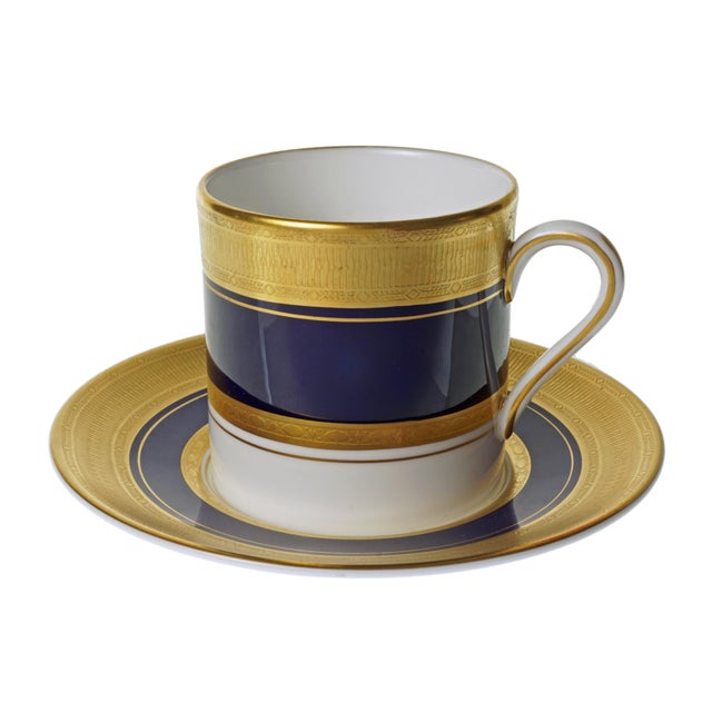 An elegant 1984 Royal Worcester “Malvern Blue” cup and saucer set featuring the refined coffee can shape, beautifully...