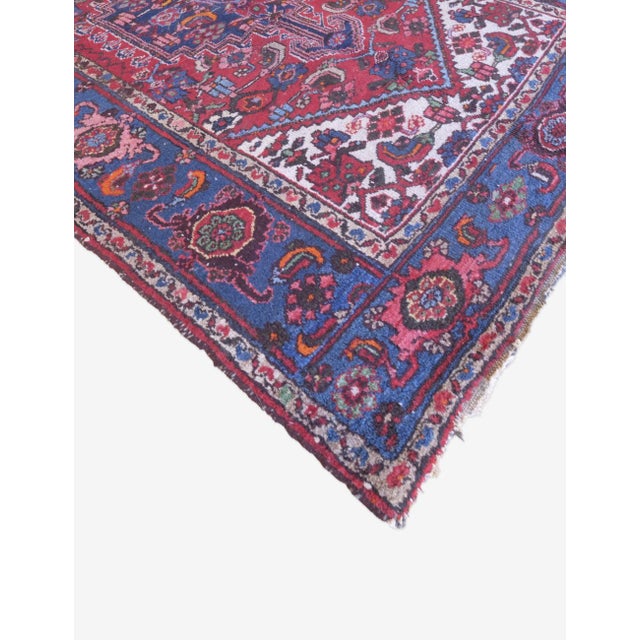 A vintage Persian rug is a handwoven textile crafted in Iran, typically over 30 years old, known for its intricate...