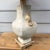 Classic 1990’s California-coastal style faux travertine lamp in a creamy off white. Beautifully-soothing colors that...