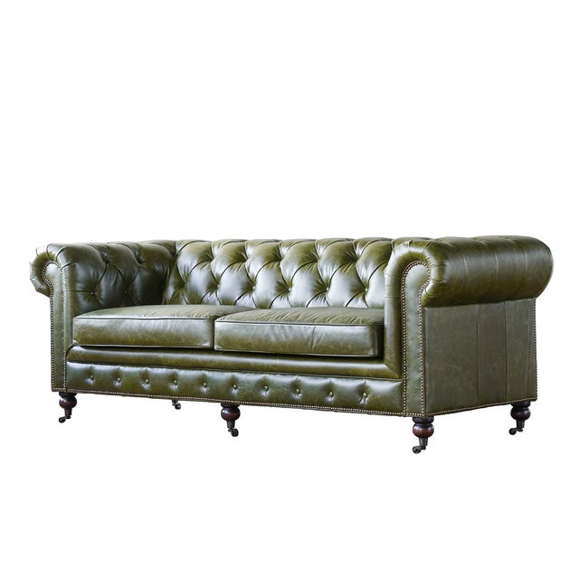 Upholstered in rich Brazilian cowhide leather, this collection stands out with its distinctive Great Britain racing green...