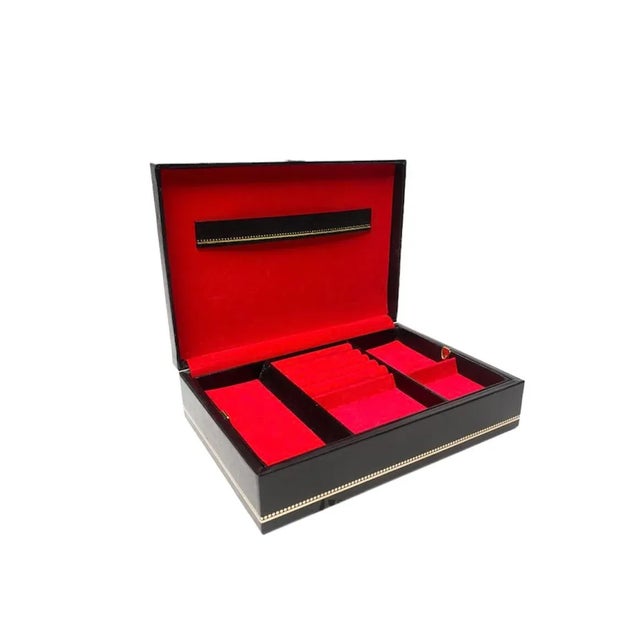 Gorgeous black vintage jewelry trinket box with gold trim and jewel tone red velvet interior, removable tray for added...