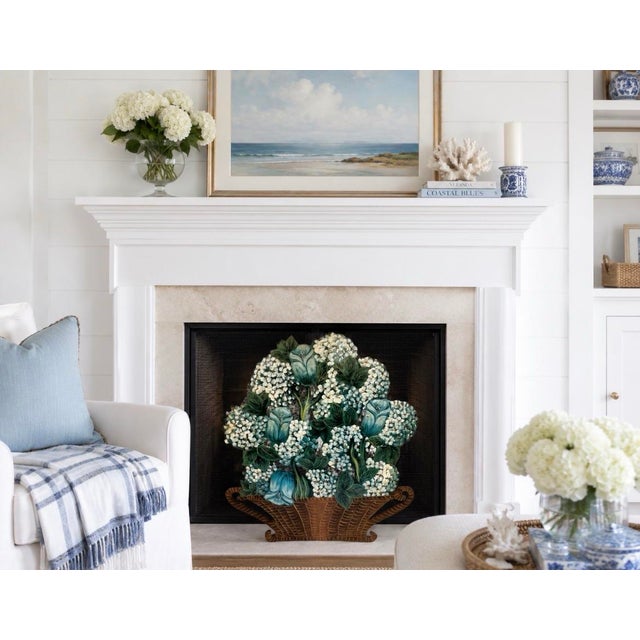 This exquisite vintage hand-painted toleware fireplace screen showcases a charming woven wicker basket with handles...