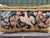 This decorative pillow is upholstered with an authentic 18th-century tapestry, showcasing a beautifully detailed bird...