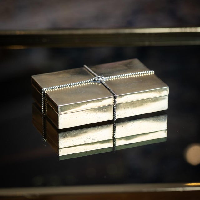 Vintage 20th Century Italian gilt solid silver cigar box by Tiffany & Co. The rectangular box is adorned with a rope twist...