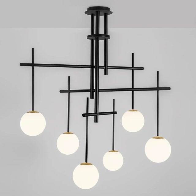 Asymmetric Vertical And Horizontal Arms Cross At Different Levels To Create A Totally Random Look. Glass Globes Hang From...