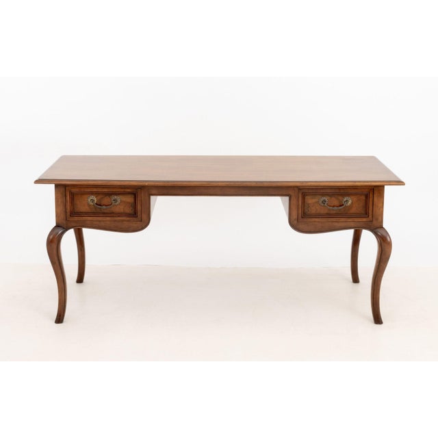 Baker Furniture French Provincial Style Walnut Desk, with two drawers on cabriole legs, "Baker Furniture" label to...