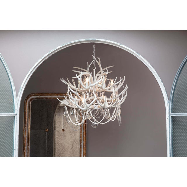 Not your traditional lodge antler chandelier, the Cheyanne was inspired by color palette of bleach sea shells and sun...