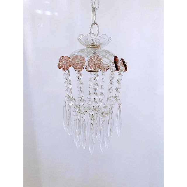 Parachute chandelier with hand cut dome, octagon chain, plain chain and 30% leaded U-drop crystals and Amethyst Rosettes....