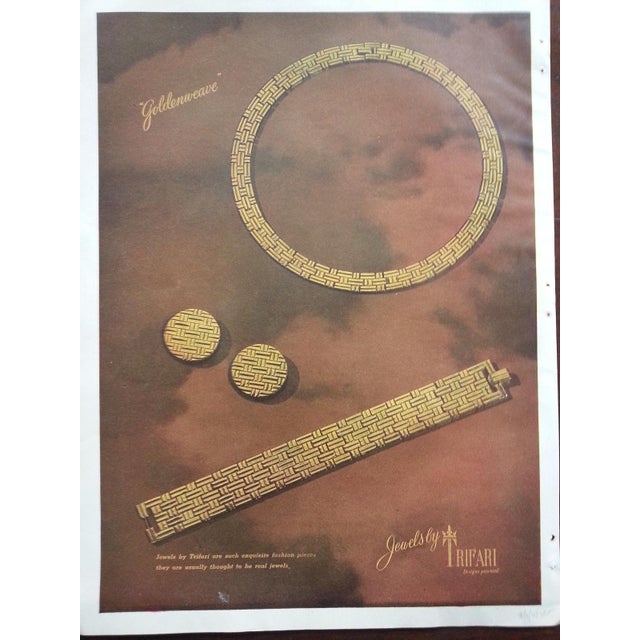 1947 round rhodium plated hatched design clip earrings. Marked crown "TRIFARI" on the clips. Measure: 7/8 inches across....