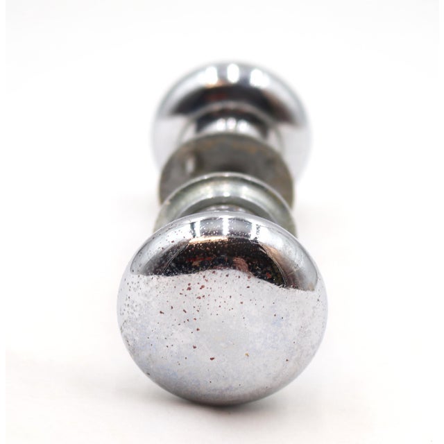 Classic style petite door knob set made of brass with a chromed finish. Priced as two door knobs, two rosettes, and a...