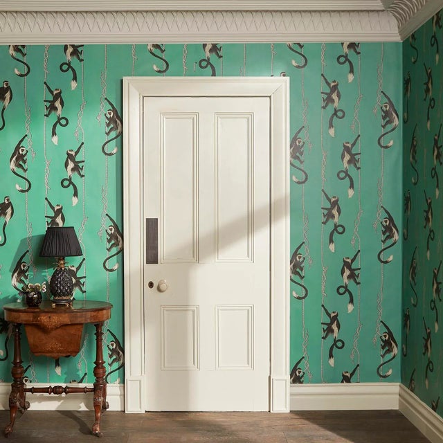 A cheeky 'Troop' of climbing monkeys is depicted in this light-hearted and charming wallpaper print. The bold green...