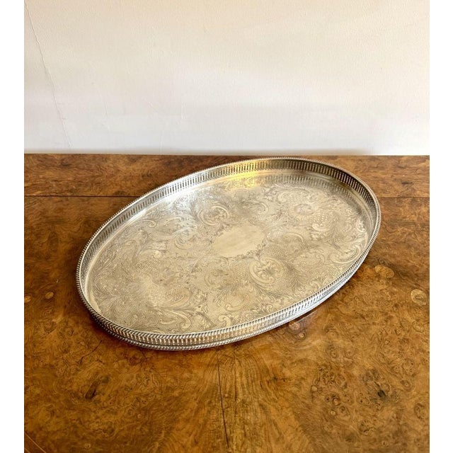 Quality antique Edwardian silver plated tray, having a quality antique Edwardian silver plated oval shaped tray with...