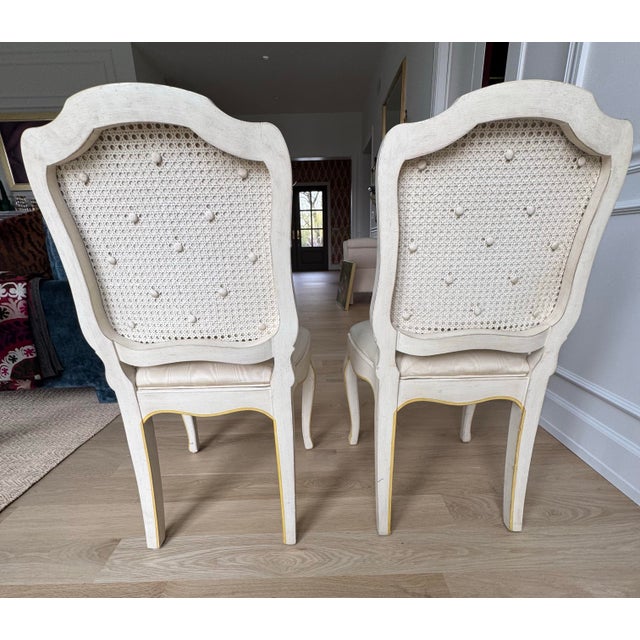 A rare pair of French Provincial side chairs by the esteemed firm Jacques Bodart. These chairs feature a sophisticated...