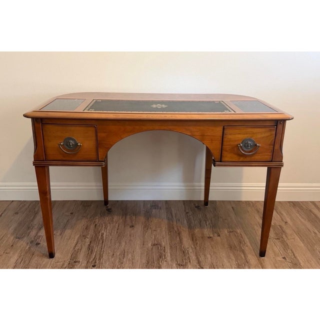 Elegant French Louis XVI Directoire style writing desk crafted in rich cherry wood with exceptional attention to detail....