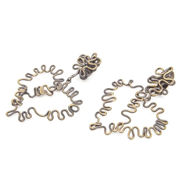 This is part of Chairish’s Costume Jewelry assortment. These studio vintage brutalist brass clip on earrings are so...