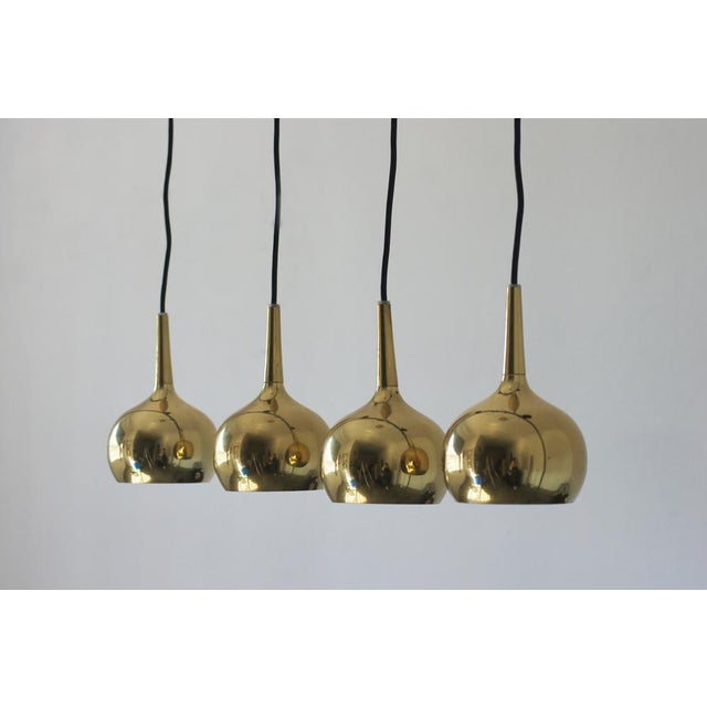 This set of four pendant lamps, manufactured by Frandsen Lighting in Denmark, is an elegant nod to the Scandinavian...