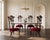 A striking set of four Christopher Guy Le Jardin dining chairs, each distinguished by a sculptural lower back of carved...
