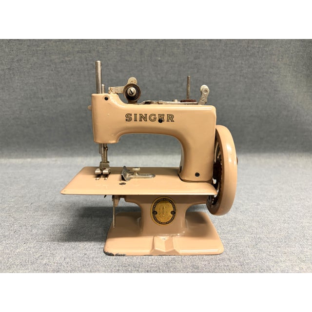 A Singer No. 20 Sewing Machine from the 1950s. The Sewhandy child's mini sewing machine was used from 1910 to 1975. The...