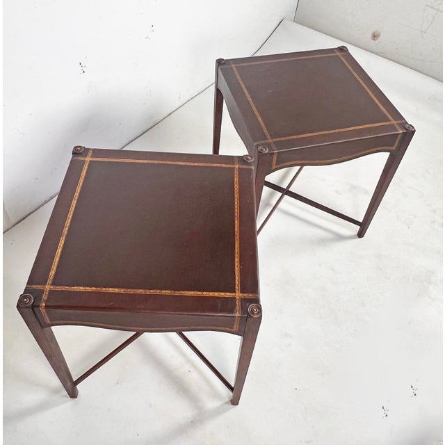 Pair of elegant Regency style end tables in solid mahogany with leather wrapped tops and sides, circa 1940s. By B & S Co.,...