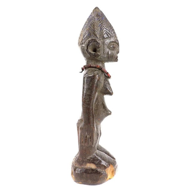 Ibeji figures, carved by the Yoruba people of Nigeria, are wooden twin sculptures holding cultural significance in Yoruba...
