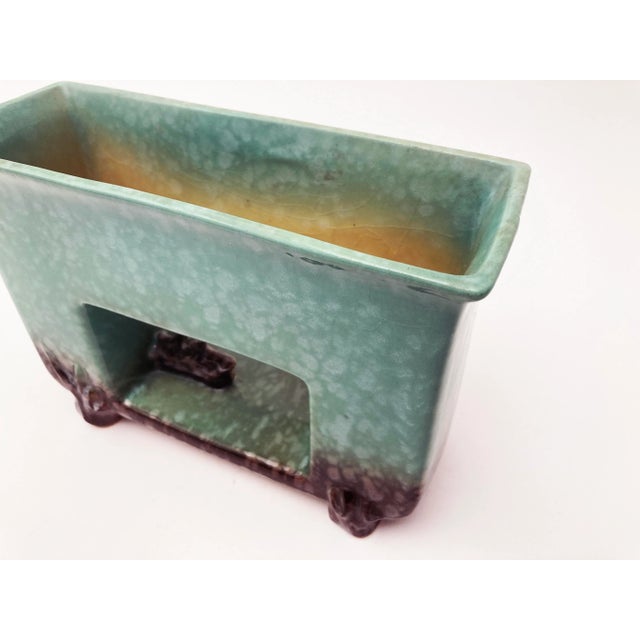 This 1054-8 Roseville Mid Century Modern planter is a stunning piece as far as pottery goes. The desirable green is of the...