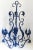 Lovely iron outdoor candelabra or wall sconce (there are two places on the back to nail or screw into a wall) with scroll...