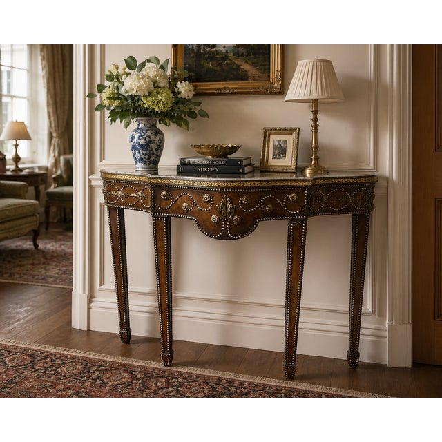 A Maitland-Smith console table from the late 20th century, exquisitely crafted with a leather-wrapped design. It showcases...