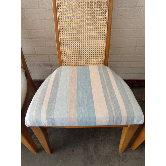 Mid-Century Modern dining chairs in the style of Milo Baughman for lane furniture. Featuring burl wood and caned high...