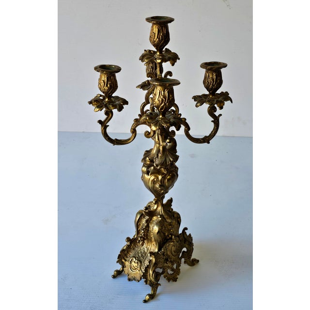 A Pair of Renaissance Revival Style Cast Brass Five Light Candelabra. Measures 8.5" in width, 8.5" in depth and 21" in...