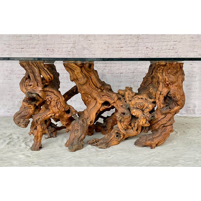 Vintage Sculptural Burlwood Dining Table with Glass Top. Organic modern table features a naturally formed intertwined...