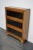 This bookcase was produced in Germany around the 1930s. It features 3 compartments with glass sliding doors. The interior...