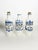 Set of three decorative ceramic bottles inspired by traditional apothecary jars. Each bottle features an inscription...